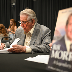 Bill Morris signed copies of his book after the panel.