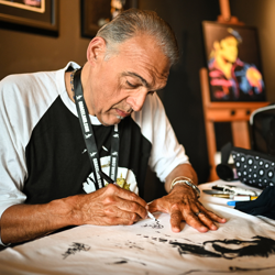 Artist Joe Petruccio created works of art in between meeting fans at Elvis Week.